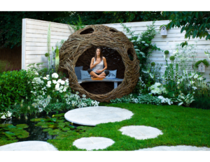 woman meditating in a garden 