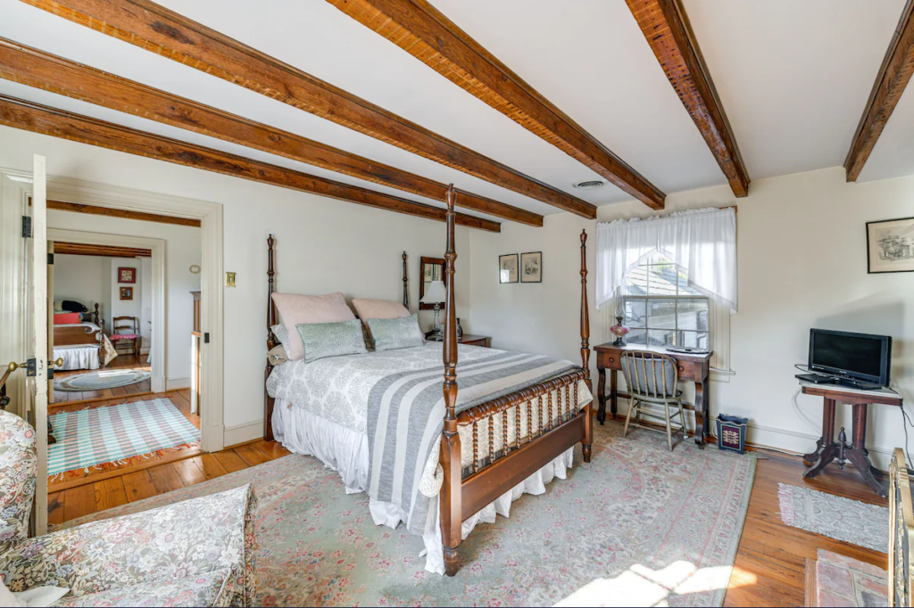 Bedroom 2 on second floor of Terre Haute Retreat Center with queen bed.