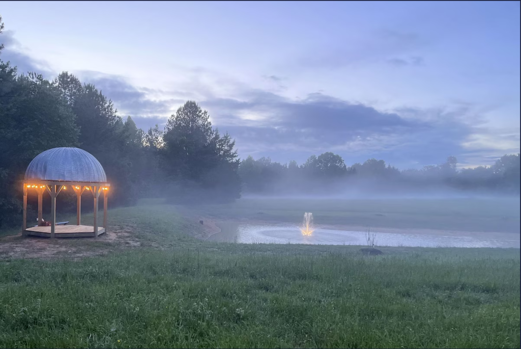 Pond and gazebo in morning early fog as the sun rises at Terre Haute Farm and Retreat Center, Midlothian VA.